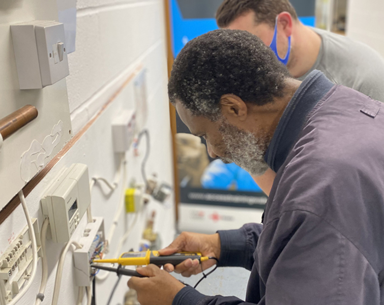 Man training for a career in electrical engineering